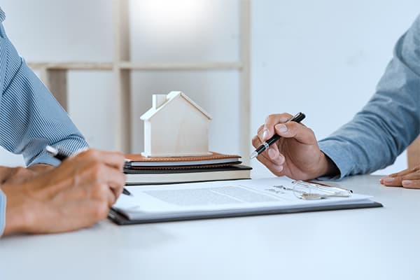 https://tower.10bestmortgage.com/wp-content/uploads/2023/06/broker-agent-and-customer-holding-pen-the-policyholder-and-explain-discussing-for-concerning-mortgage-loan-offer-for-and-house-insurance.jpg